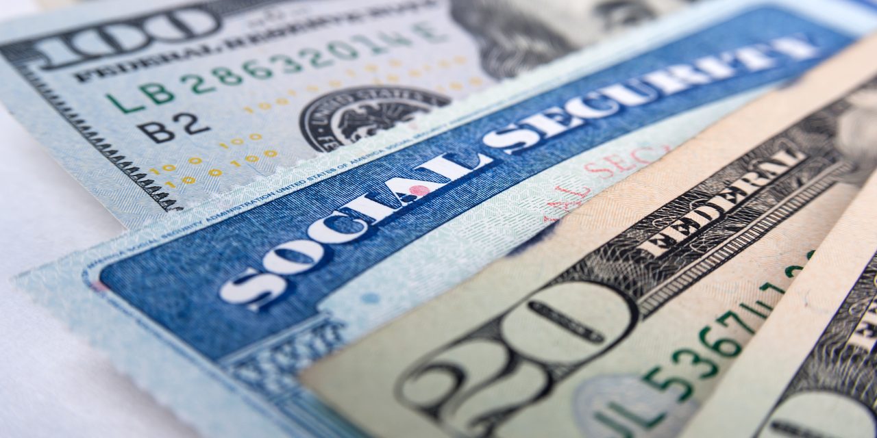 Social security card and American money dollar bills Social security card and American money dollar bills close up concept